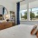a bedroom with a bed and a mirror