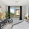 a bedroom with a large window
