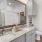 a bathroom with a large mirror and a easy-to-access closet