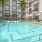 a pool with a building in the background