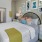 a bedroom with a bed and lamps