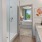 a bathroom with a glass shower and easy-to-access door to the bedroom