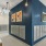 a blue wall with pictures on it